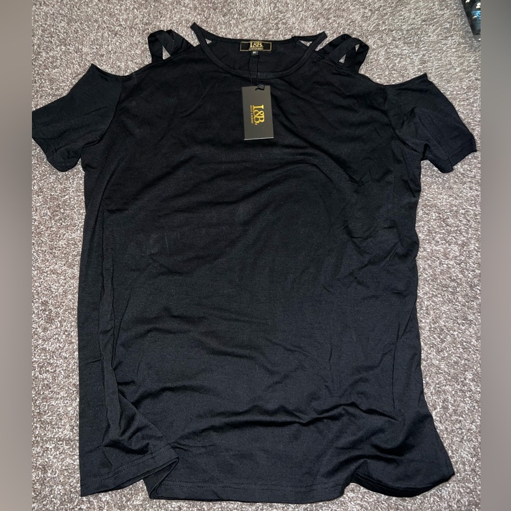 New in packaging. Women’s black blouse. Sizes xl-3x